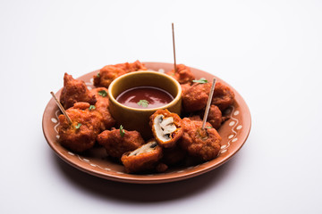 Mushroom 65, starter or appetiser food recipe from India. served in a plate with ketchup. selective focus