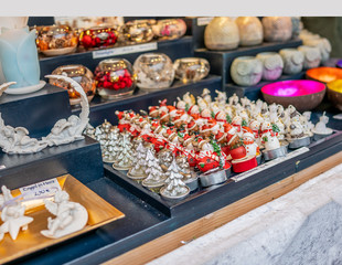 Selective focus of Christmas decorations on display for sale at the 2019 Christmas market in Aachen, Germany