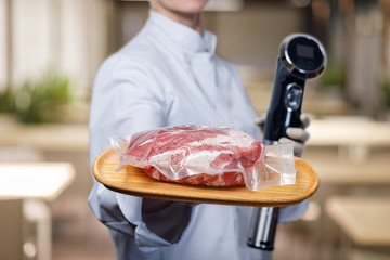 Shows cook sous vide immersion circulator cooker and the meat .
