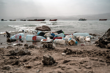 different plastic garbage on the beach