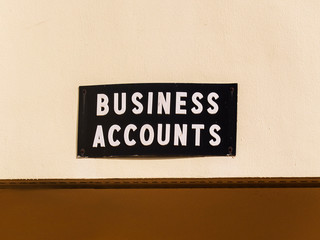 Business Accounts Sign on the Side of a Commercial Building