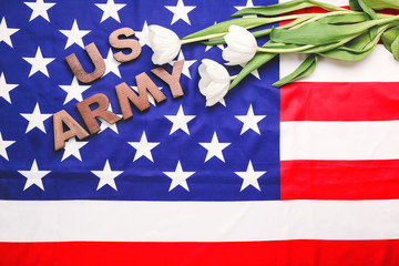 Text US ARMY and flowers on American flag. Memorial Day celebration