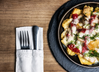 hot pan with potato, mushrooms, tomato