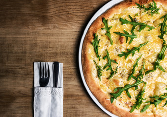 pizza with cheese and green arugula