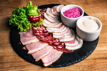 sliced lard salami and ham