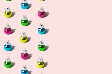 Colorful baubles Christmas decoration pattern on pastel background minimal creative holiday concept.