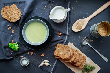green cream broccoli soup with rye bread. 