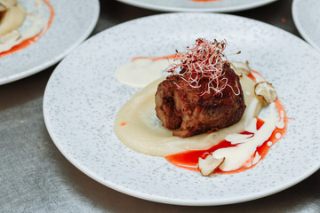 Filet mignon (small filet), the medallion is a piece of beef, cut thin section of the tenderloin. It is used to prepare delicious dishes of natural meat - filet mignon steaks.