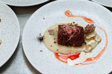 Filet mignon (small filet), the medallion is a piece of beef, cut thin section of the tenderloin. It is used to prepare delicious dishes of natural meat - filet mignon steaks.