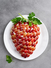 Healthy appetizer, tiffany chicken and cheese salad in the shape of cluster (bunch) of grapes on...