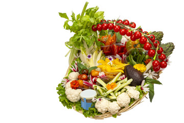 Gift basket with a selection of mixed vegetables on a white background