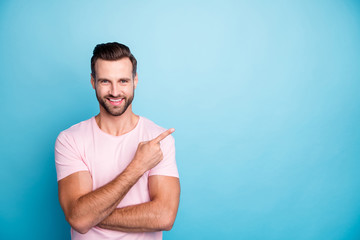 Photo of funny guy indicating finger empty space advising cool low discount prices best quality...