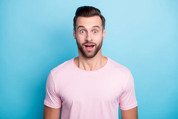 Closeup photo of amazing guy with open mouth not believe eyes astonished unexpected good news wear casual pink t-shirt isolated blue color background