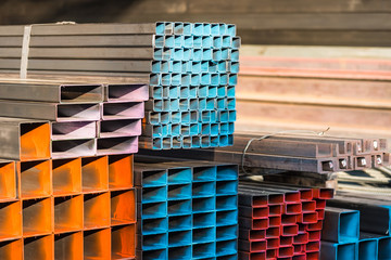 Metal profile channel in packs at the warehouse of metal products.