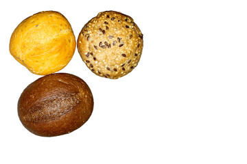 Three buns isolated on a white background. Selective focus. Space for lettering or design.