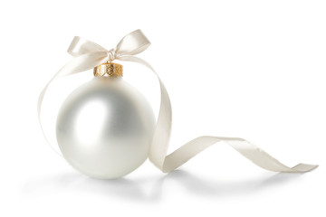 Beautiful Christmas ball with ribbon on white background