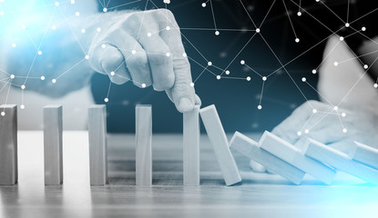 Concept of business control by stopping domino effect; multiple exposure