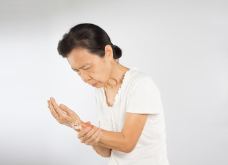 old asian woman feel wrist bones injury	