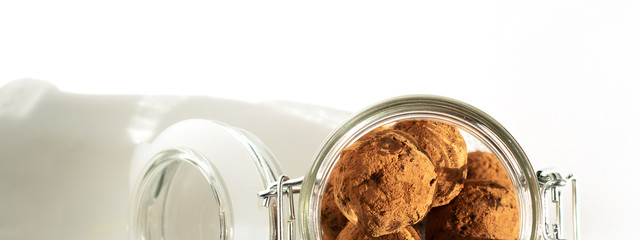 Energy balls in a jar with a yoke lock. Sharp shadows in daylight. Top view