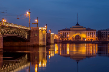 Palace bridge and part of the Admiralty building in the reflection of the Neva
