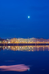 Fototapeta na wymiar the building of the Senate and Synod on the English embankment of the Neva early in the morning under the moon