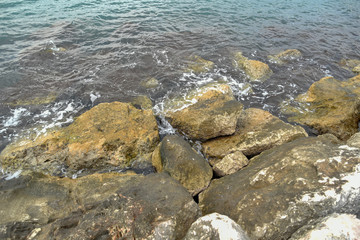 Rocks in the Beach of Mattinata with Cloudy Sky