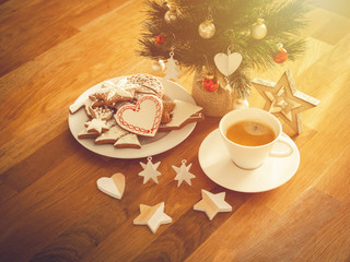 Christmas or New Year composition with gingerbread cookies, coffee and christmas decorations. Christmas decorations and coffee cup. 