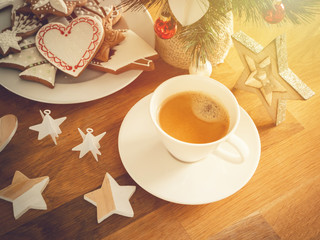 Christmas or New Year composition with gingerbread cookies, coffee and christmas decorations. Christmas decorations and coffee cup. 