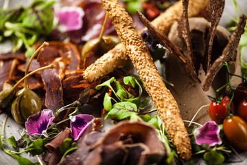 Meat platter for two served on a plate in restaurant