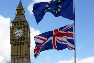Fototapeta na wymiar EU and UK flags flying high in London during an anti-Brexit rally