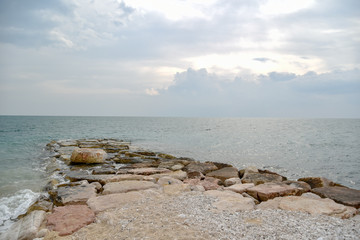 Rocks in the Beach of Mattinata with Cloudy Sky