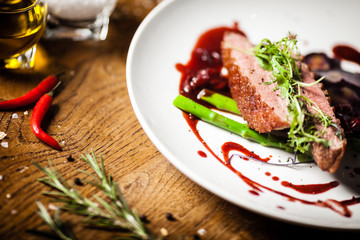 Duck breast served on a plate in restaurant
