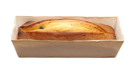 Fruit cake, loaf in paper bag packaging isolated on white background