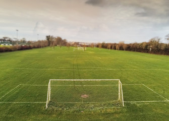 Soccer goal and field, selective focus, Nobody, Worn out turf in goalkeeper spot, Concept training, exercise.