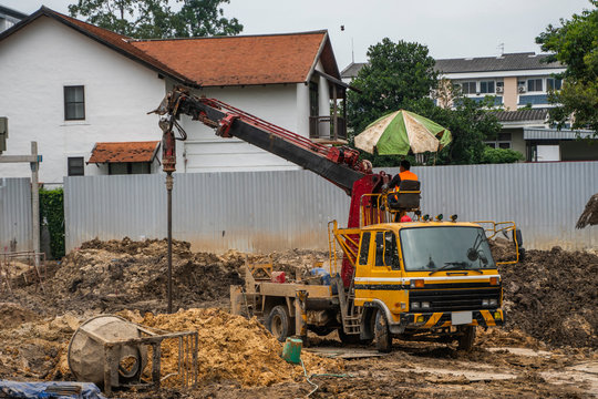 Drilling rigs for the construction of building foundations. Construction work. Drilling pile foundations under the ground. Boring holes in ground with drilling rig during building construction.