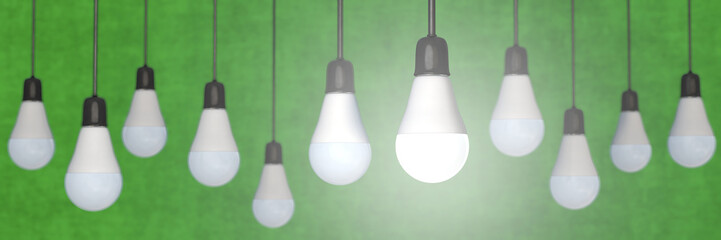 Many LED-bulbs in panoramic format with green background