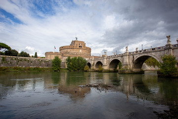 View of the Tiber river and the castle of St Angelo in the background