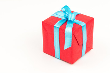 Gift box with ribbons and christmas decor isolated on white background. Happy birthday colorful gift