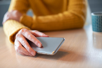 Woman Concerned About Excessive Use Of Social Media Laying Mobile Phone Down On Table © Daisy Daisy