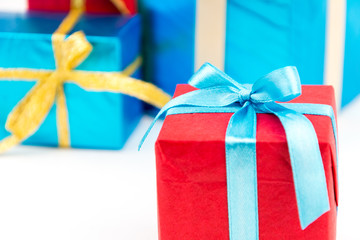 Gift boxes with ribbons and christmas decor isolated on white background. Happy birthday colorful gifts