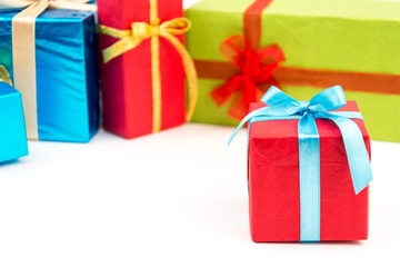 Gift boxes with ribbons and christmas decor isolated on white background. Happy birthday colorful gifts