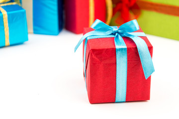 Gift boxes with ribbons and christmas decor isolated on white background. Happy birthday colorful gifts