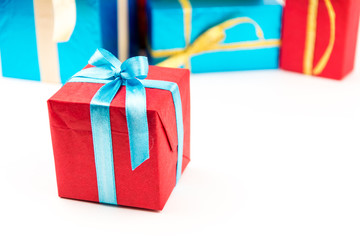 Gift boxes with ribbons and christmas decor isolated on white background. Happy birthday colorful gifts