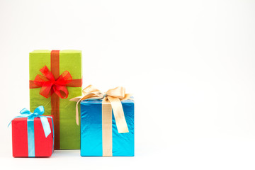 Gift boxes with ribbons and christmas decor isolated on white background. Happy birthday colorful gifts