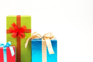 Fototapeta premium Gift boxes with ribbons and christmas decor isolated on white background. Happy birthday colorful gifts