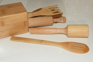 kitchen utensils on wooden board