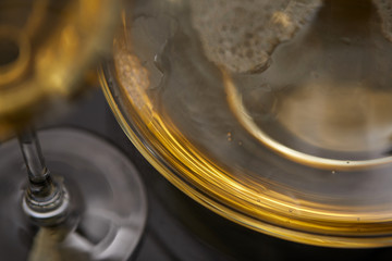 A glass full of wine and wine decanters