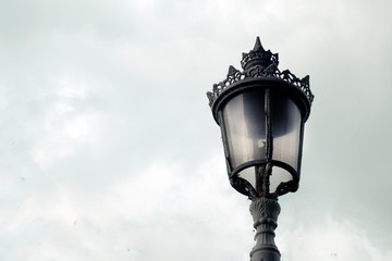 Fototapeta na wymiar white vintage lantern against the sky