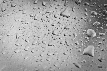 rain drops on a metal surface