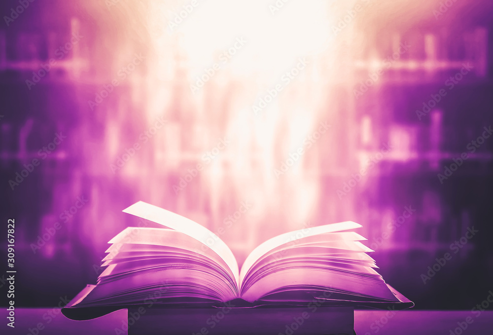 Poster imagine a picture book of an ancient book opened on a wooden table with a sparkling golden backgroun